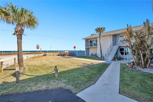 a house view with a backyard space