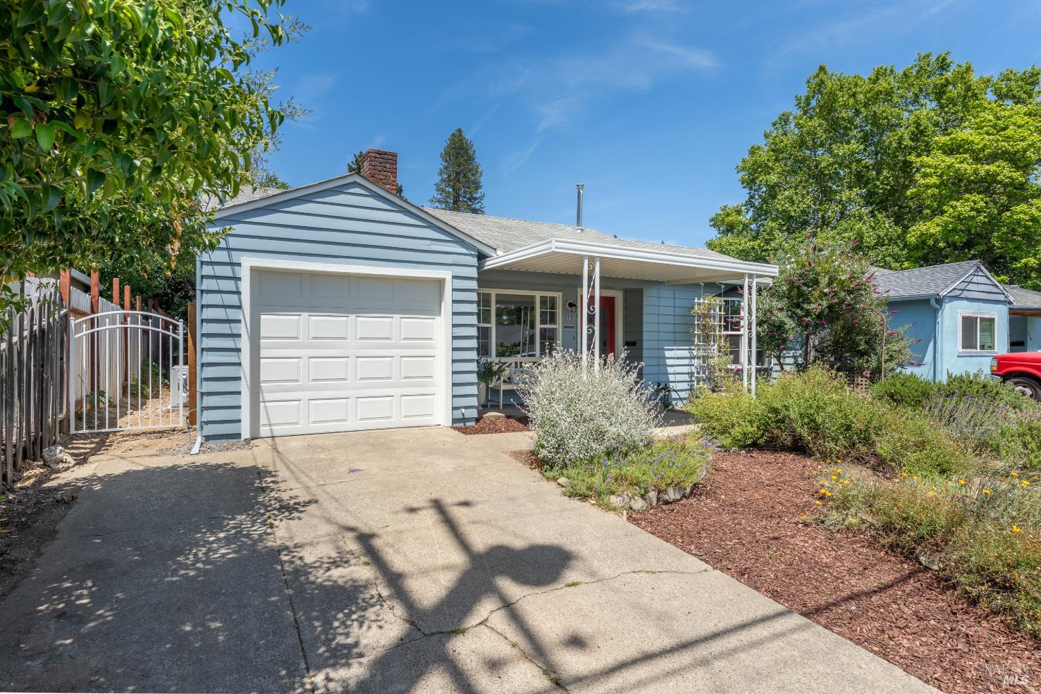 262 Magnolia Street Ukiah, CA 95482 - Photo 34 of 34 a front view of a house with a yard and potted plants