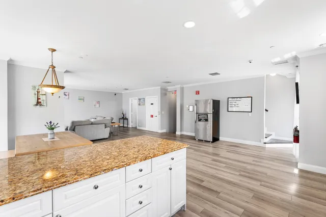 a en suite bathroom with double vanity sink and a mirror