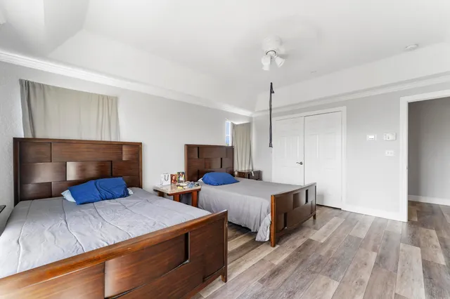 a living room with furniture windows and a flat screen tv