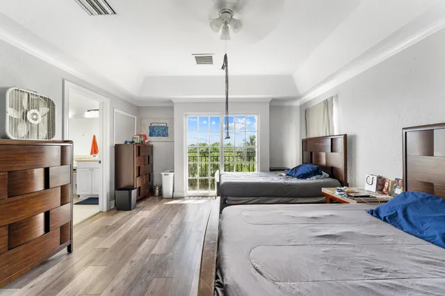 a bathroom with a sink double vanity granite and a bathtub