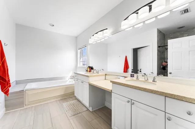 a living room with a couch and a table with wooden floor