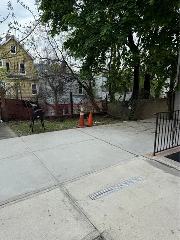 a view of a bench in a backyard of house