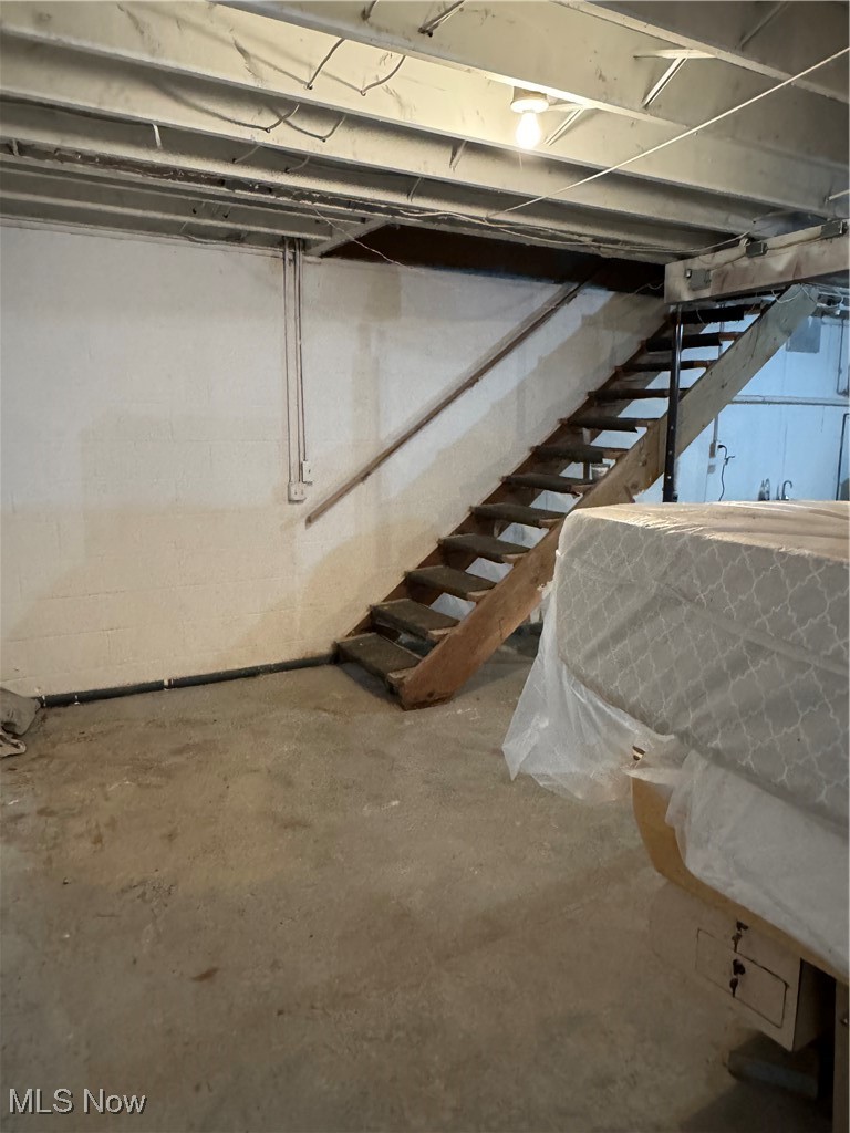 8631 Center Road Ashtabula, OH 44004 - Photo 21 of 25 Unfinished basement featuring stairs