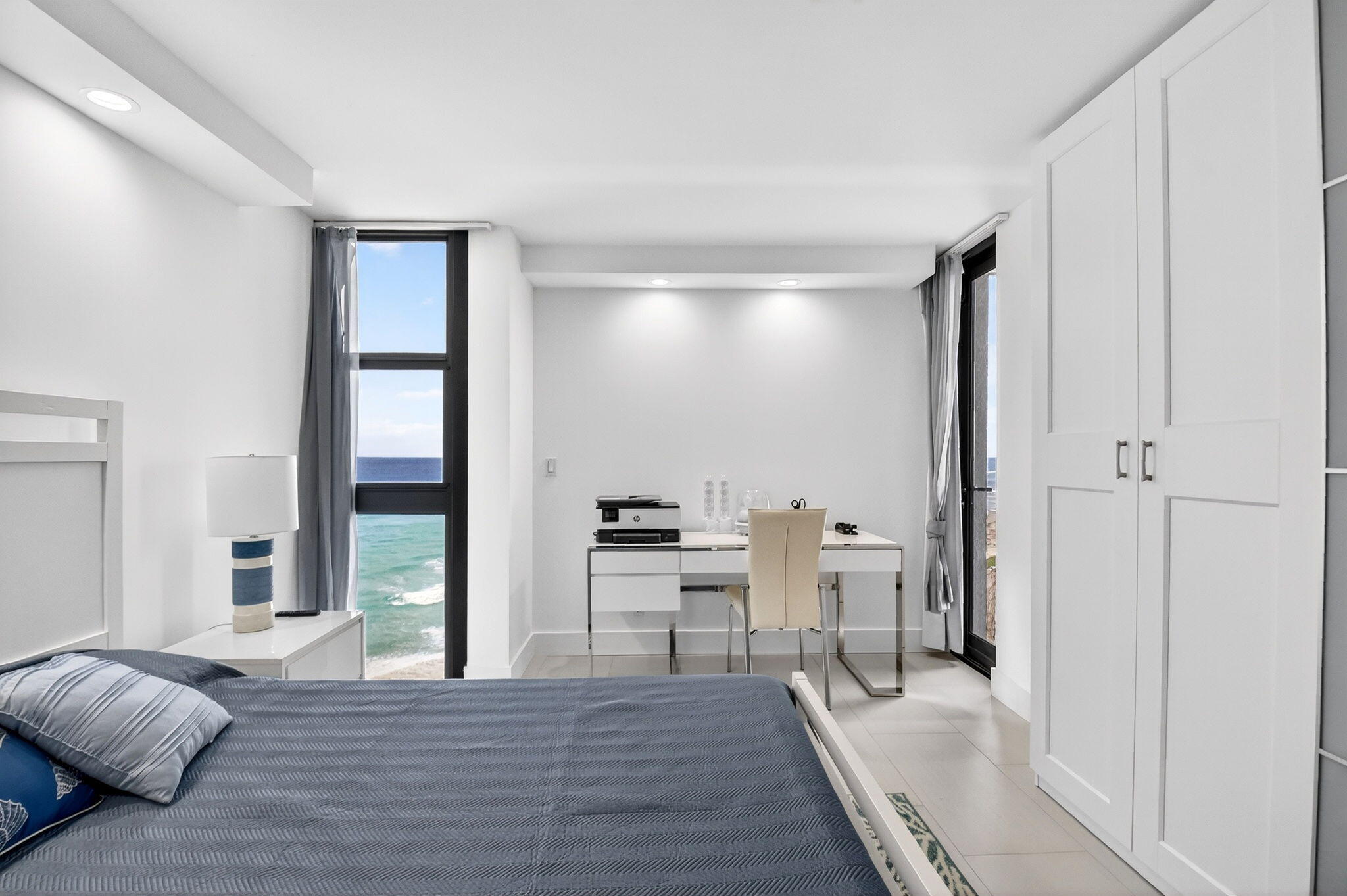 5540 North Ocean Drive, Unit 9B Singer Island, FL 33404 - Photo 14 of 57 a view of a bedroom with furniture and window