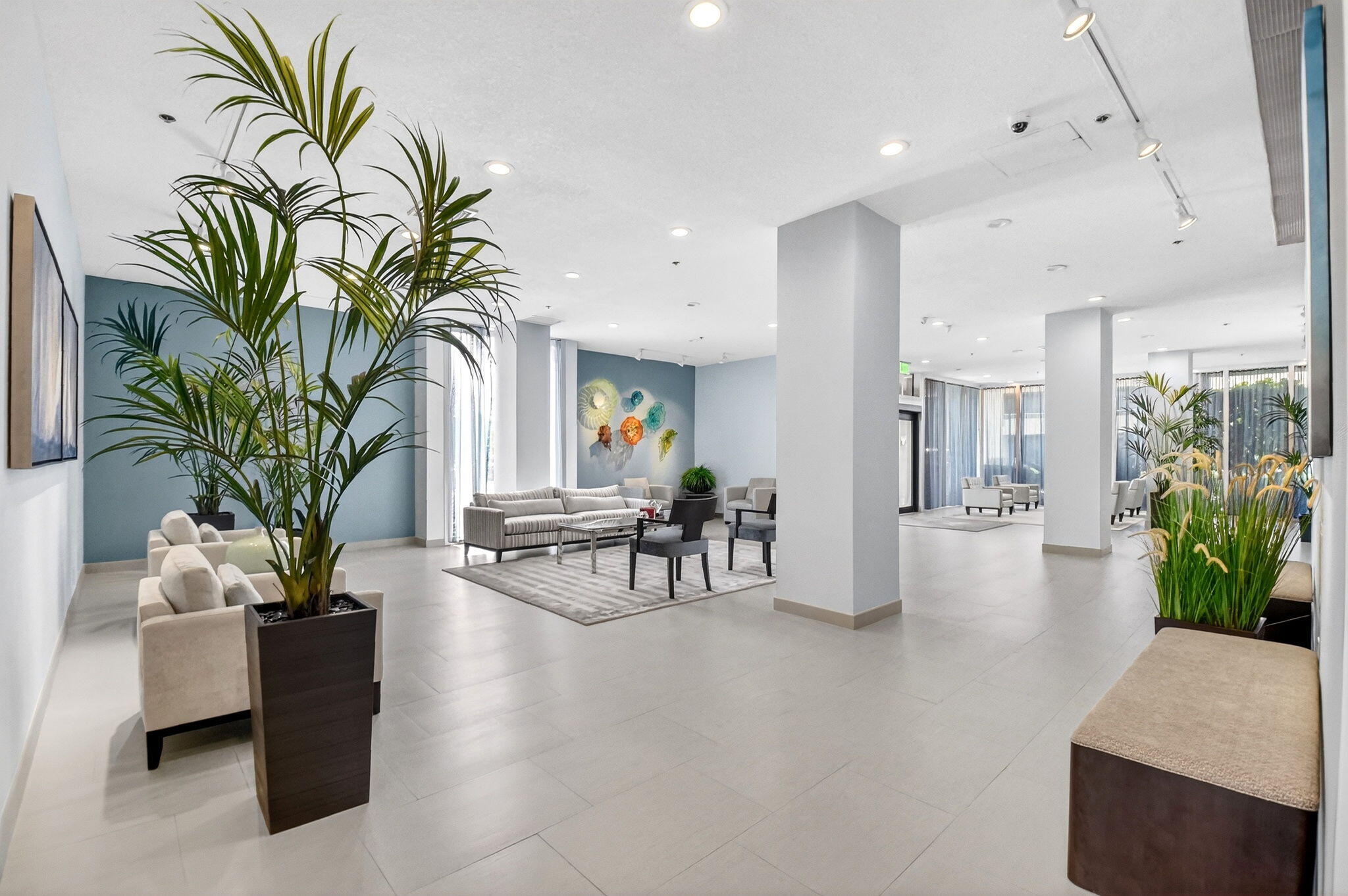 5540 North Ocean Drive, Unit 9B Singer Island, FL 33404 - Photo 17 of 57 a living room with furniture and a potted plant