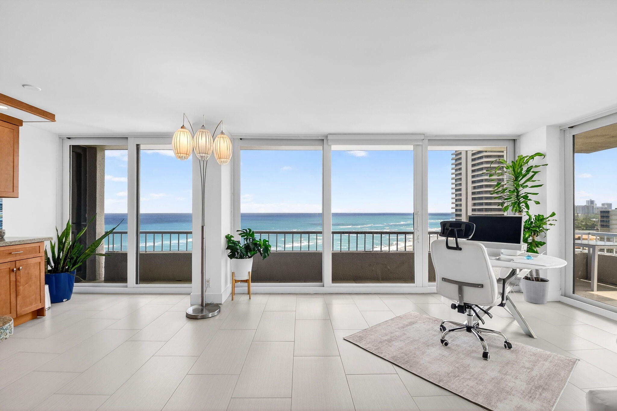5540 North Ocean Drive, Unit 9B Singer Island, FL 33404 - Photo 22 of 57 a living room with furniture and large windows