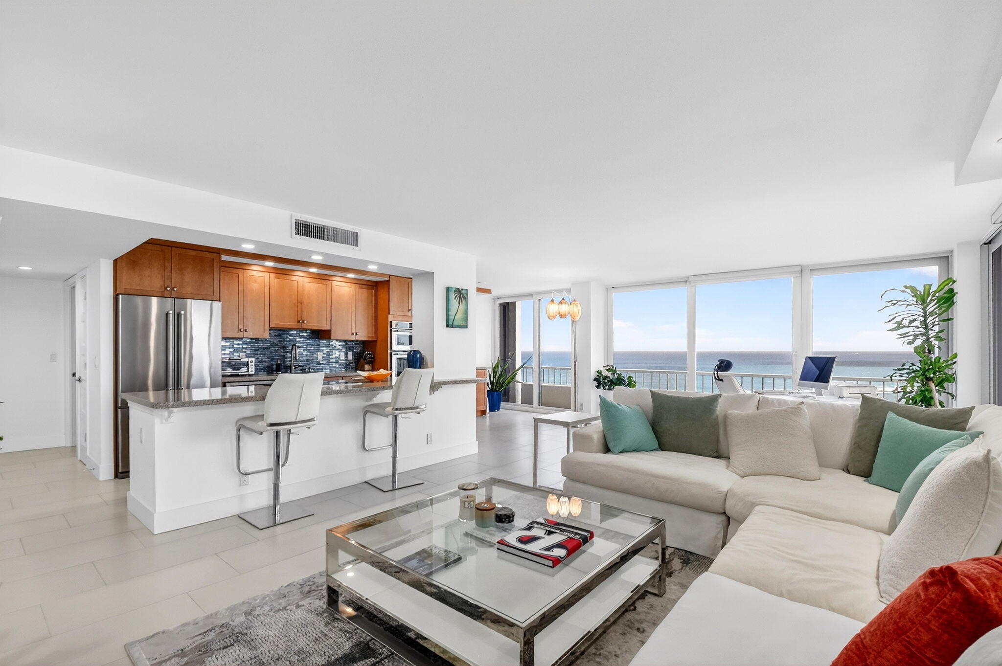 5540 North Ocean Drive, Unit 9B Singer Island, FL 33404 - Photo 25 of 57 a living room with furniture and a table