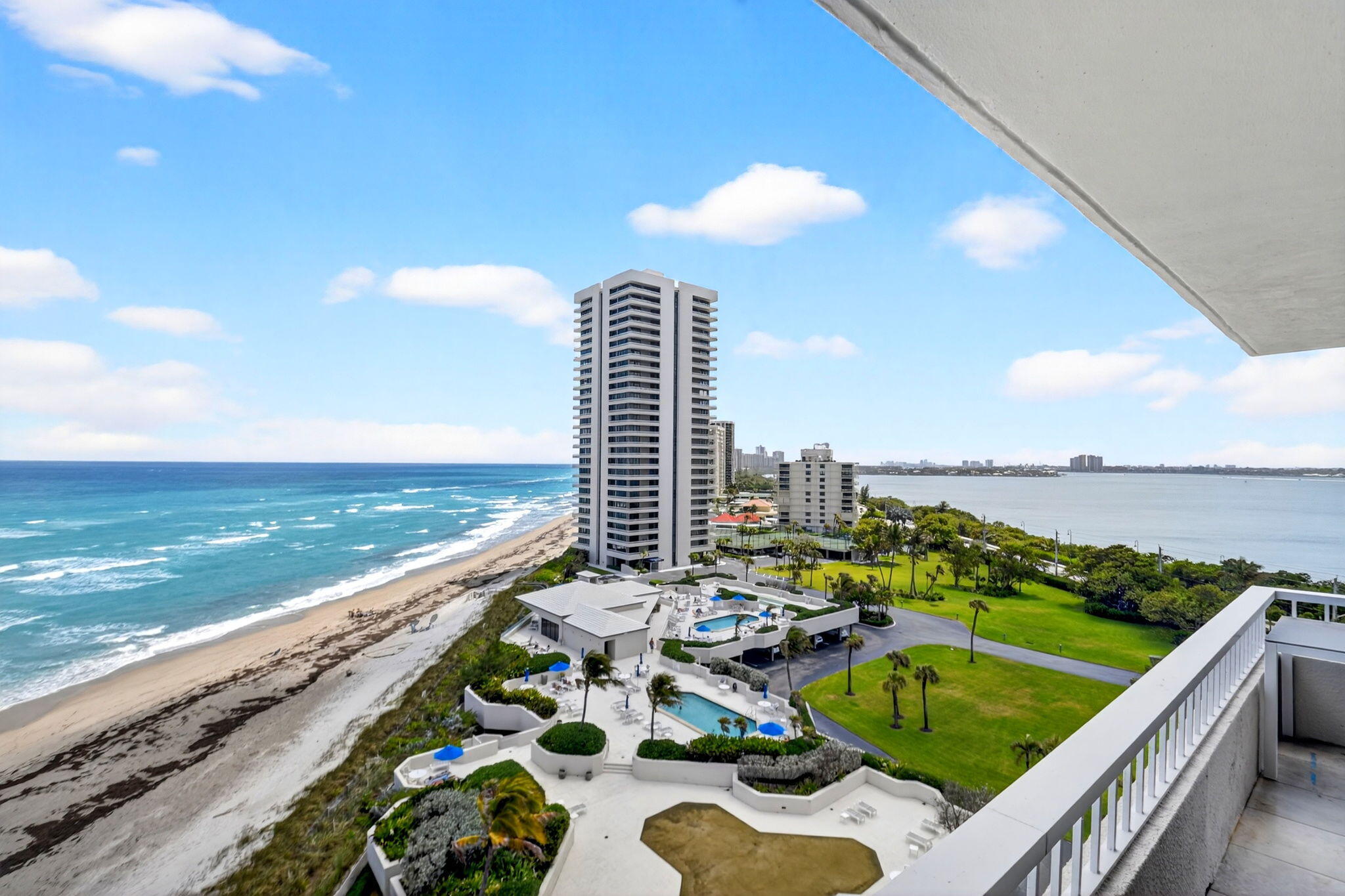 5540 North Ocean Drive, Unit 9B Singer Island, FL 33404 - Photo 30 of 57 a view of a swimming pool with furniture