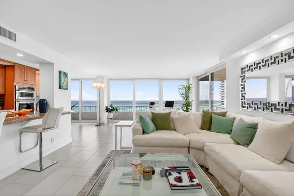 a living room with furniture and a rug