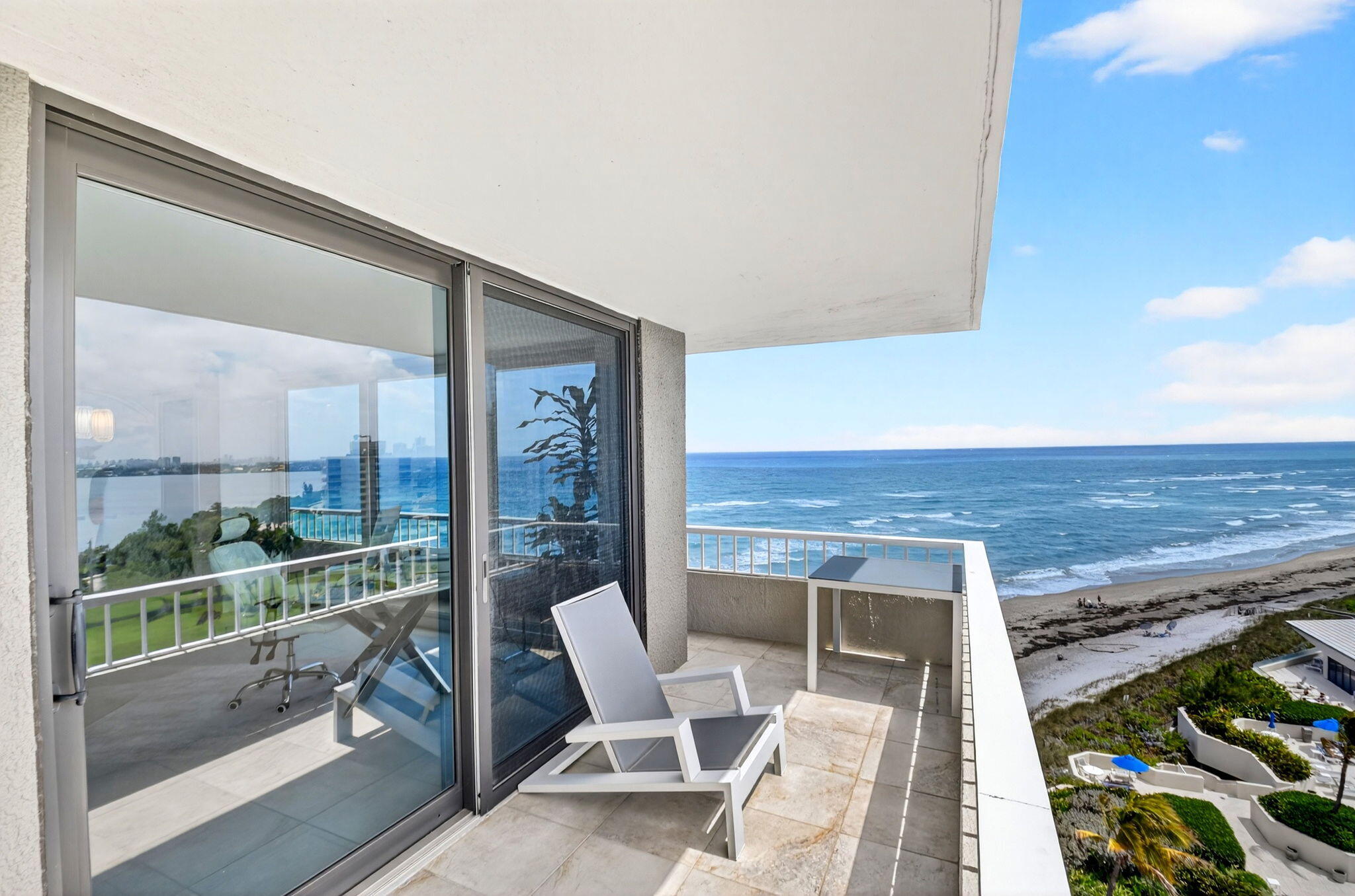 5540 North Ocean Drive, Unit 9B Singer Island, FL 33404 - Photo 34 of 57 a view of a terrace with a table and chairs