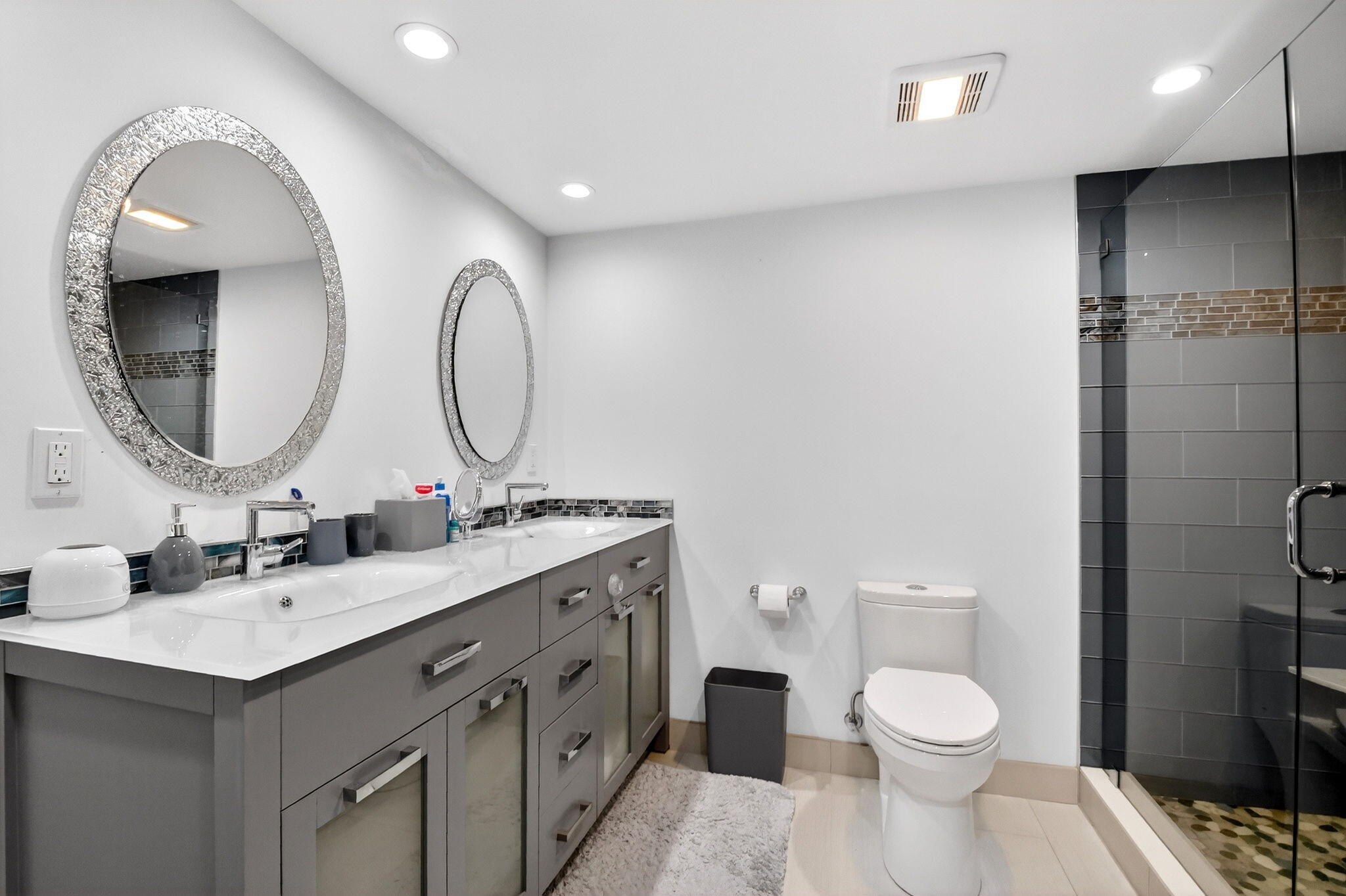 5540 North Ocean Drive, Unit 9B Singer Island, FL 33404 - Photo 38 of 57 a bathroom with a toilet a sink and a mirror