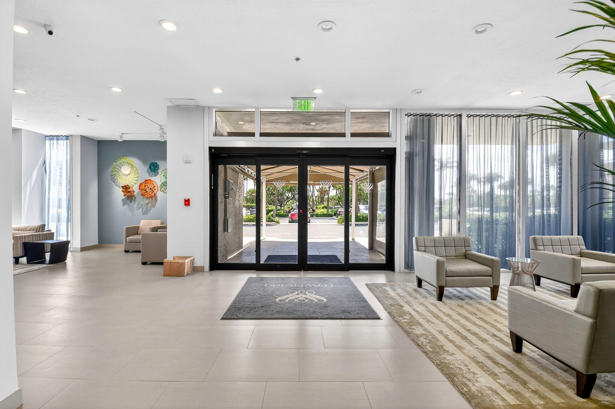 5540 North Ocean Drive, Unit 9B Singer Island, FL 33404 - Photo 42 of 57 a view of living room filled with furniture and large windows