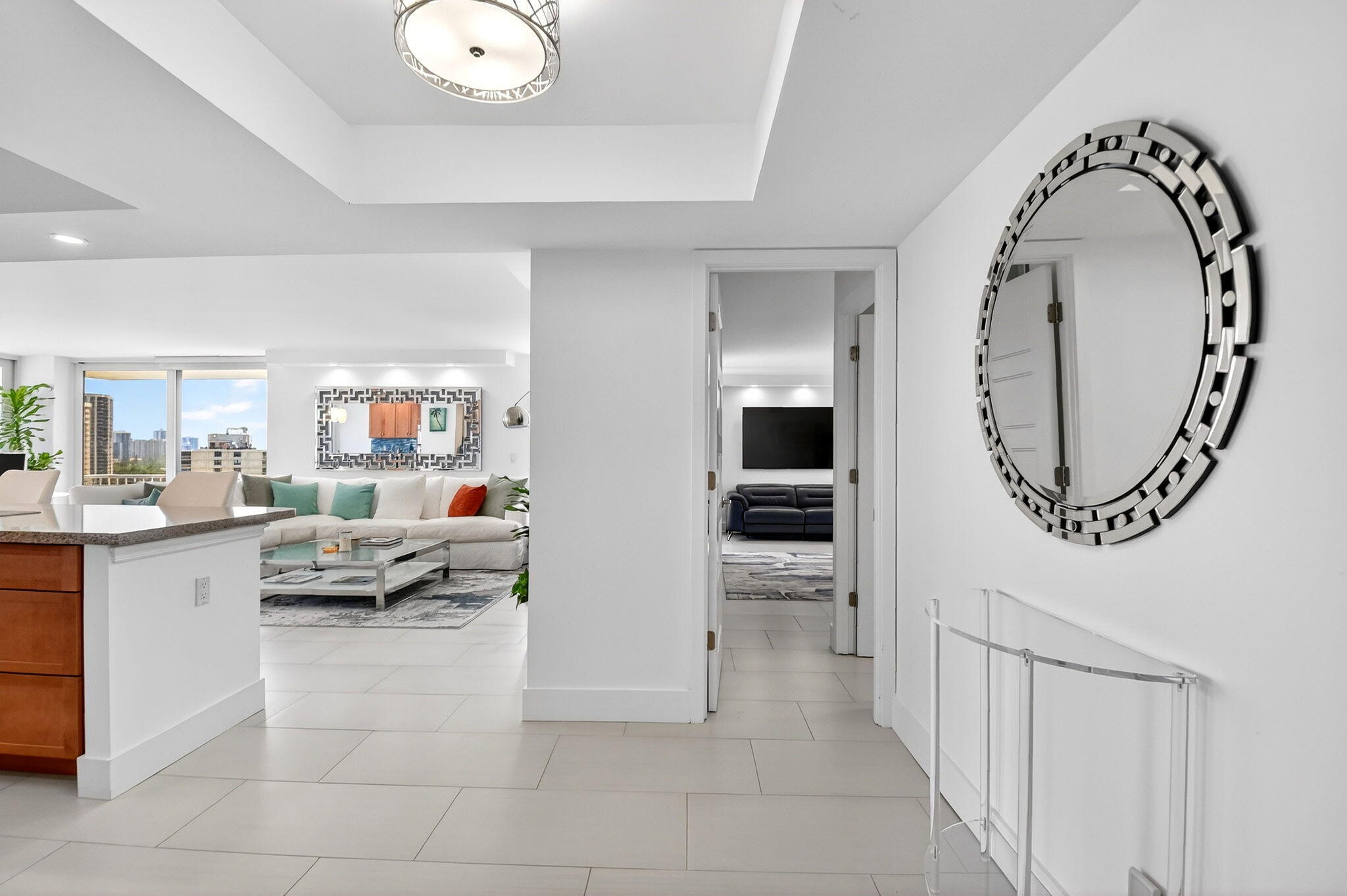 5540 North Ocean Drive, Unit 9B Singer Island, FL 33404 - Photo 7 of 57 a living room with furniture and a mirror