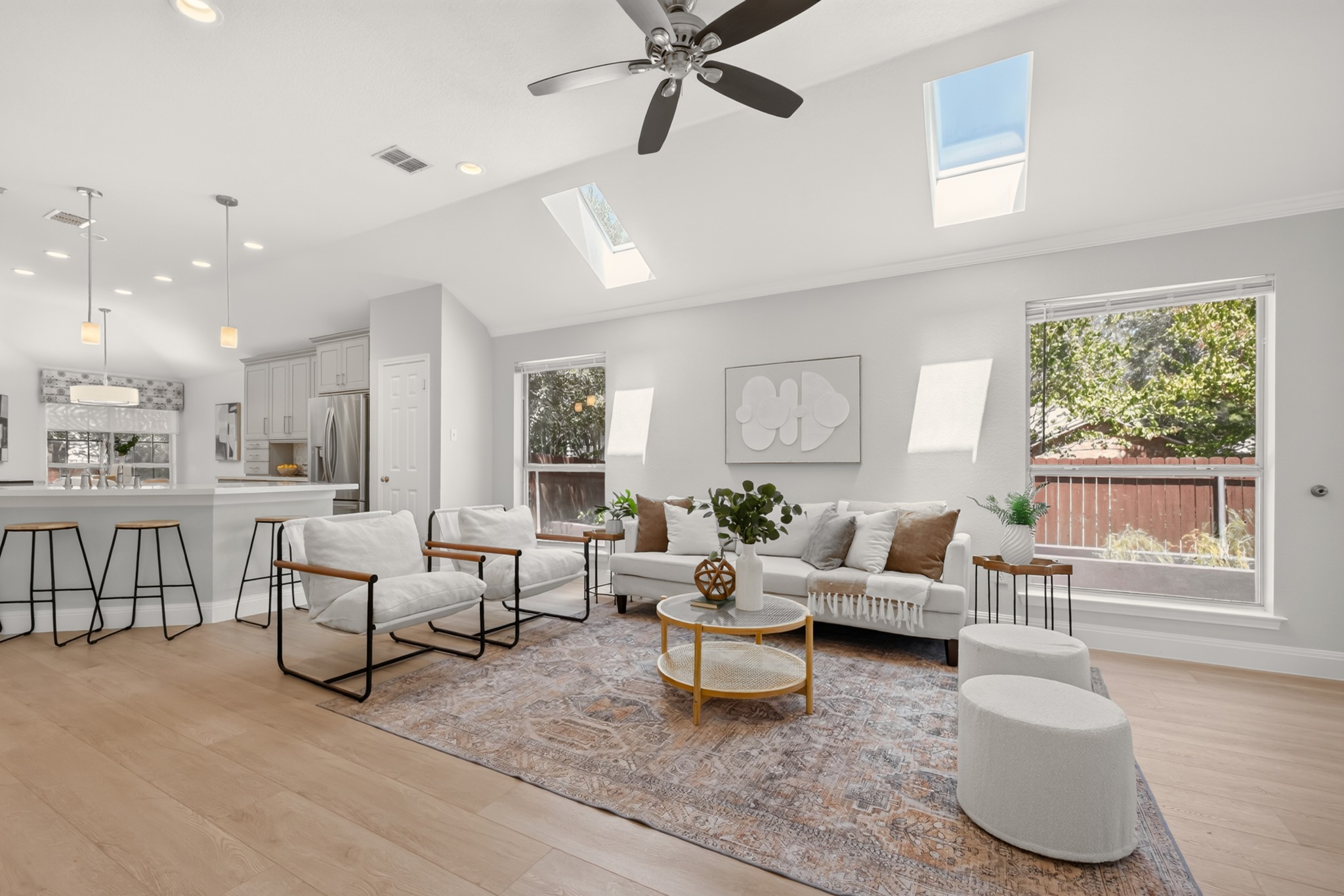 13536 Anarosa Loop Austin, TX 78727 - Photo 3 of 31 High vaulted ceilings draw your eye upward, giving the main gathering space an open, uncrowded feel for quiet evenings or host duties