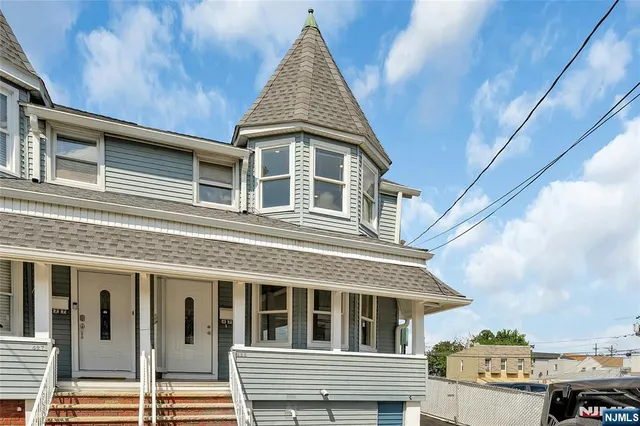 a front view of a house with a balcony