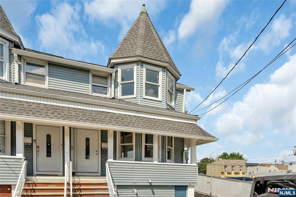 a front view of a house with a balcony