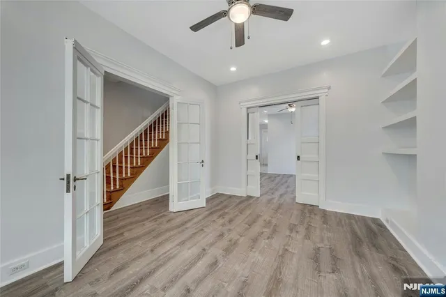 wooden floor in an empty room with a gallery