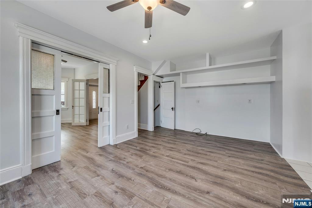 425 Hancock Place Fairview, NJ 07022 - Photo 8 of 31 a view of empty room with wooden floor