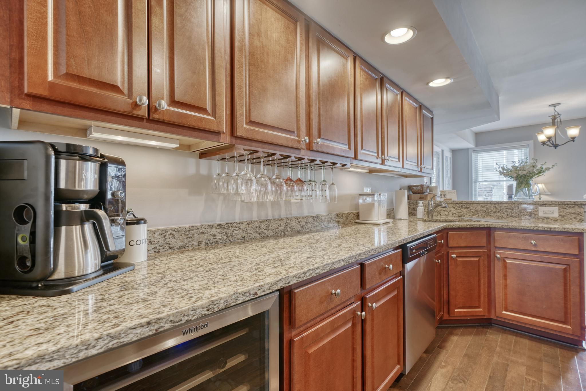 1818 Byrd Street Baltimore, MD 21230 - Photo 12 of 48 a kitchen with granite countertop stainless steel appliances sink microwave and stove