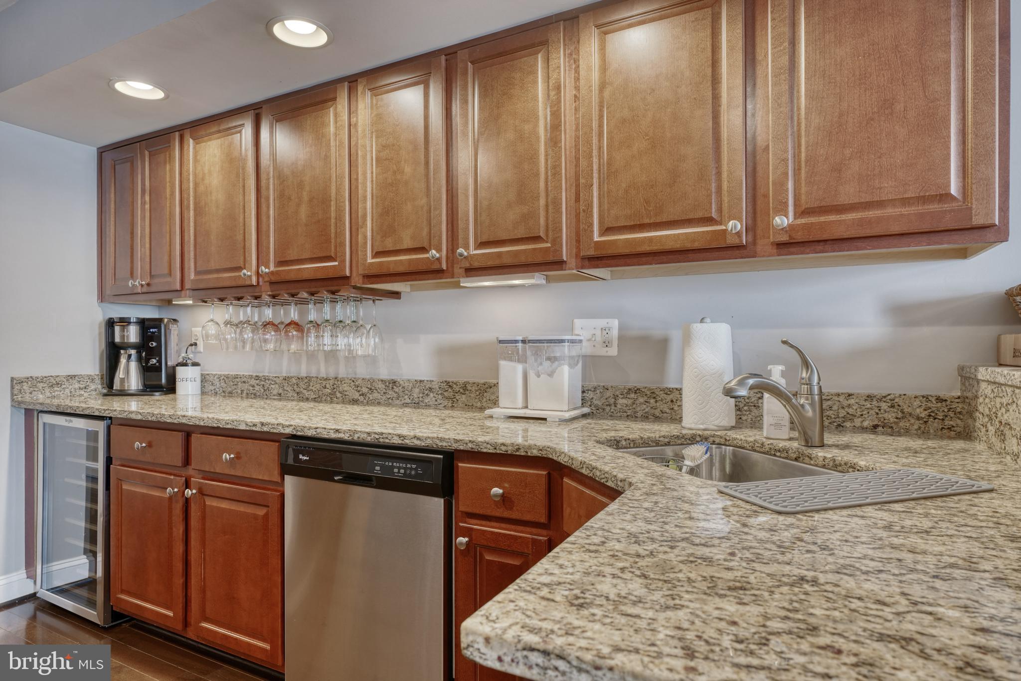 1818 Byrd Street Baltimore, MD 21230 - Photo 16 of 48 a kitchen with stainless steel appliances granite countertop wooden cabinets a sink and dishwasher