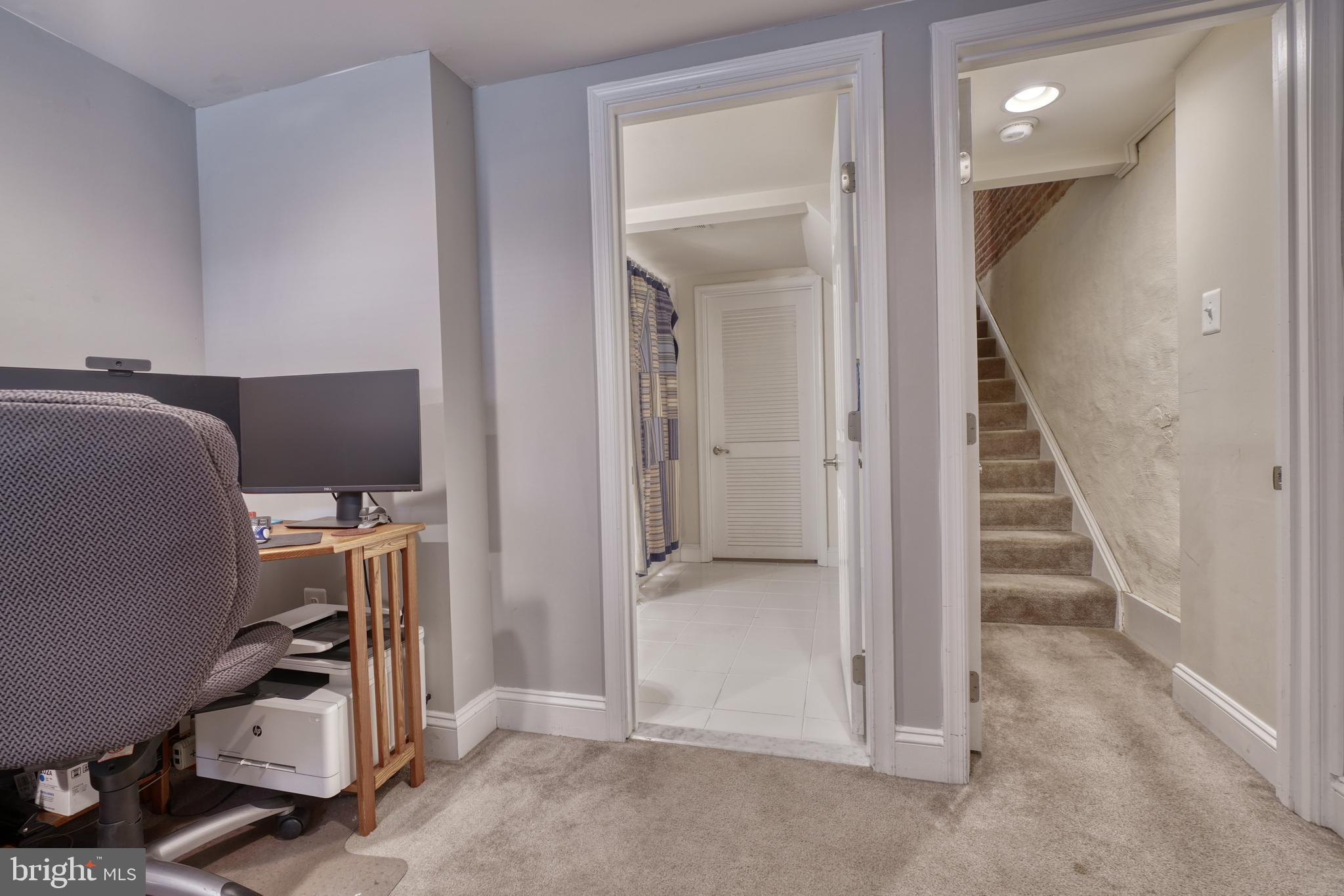 1818 Byrd Street Baltimore, MD 21230 - Photo 25 of 48 a view of a hallway with workspace and closet