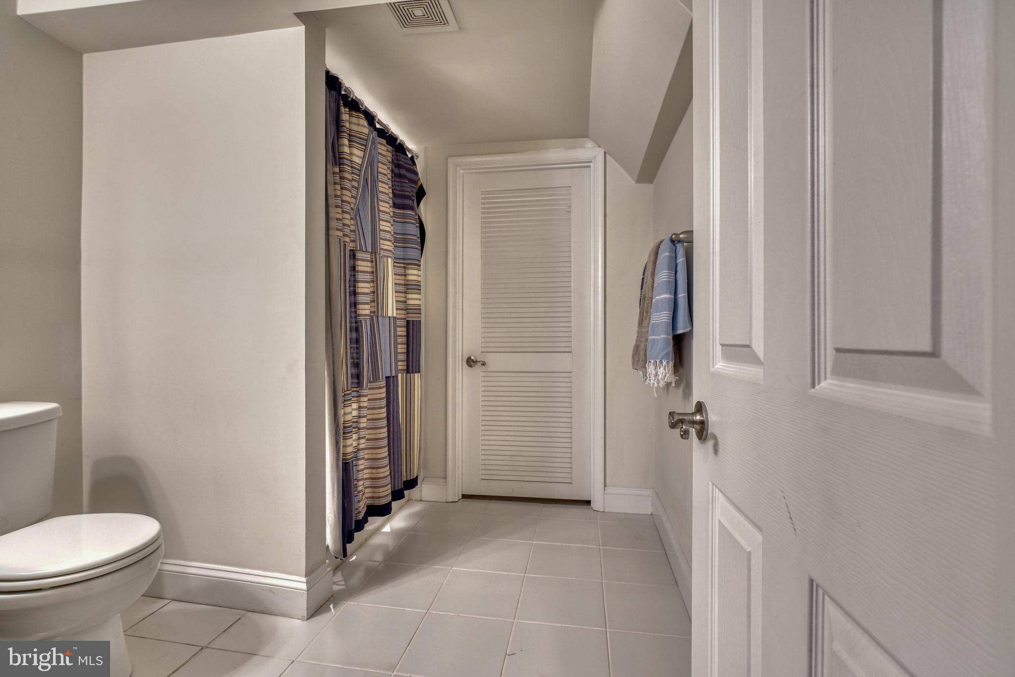 1818 Byrd Street Baltimore, MD 21230 - Photo 26 of 48 a bathroom with a toilet and a shower