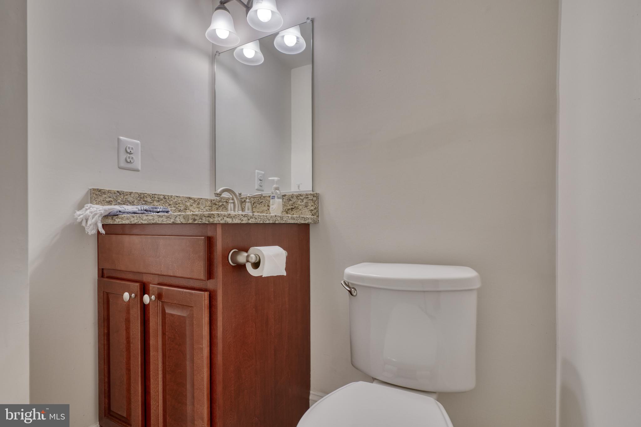 1818 Byrd Street Baltimore, MD 21230 - Photo 28 of 48 a bathroom with a toilet sink and mirror