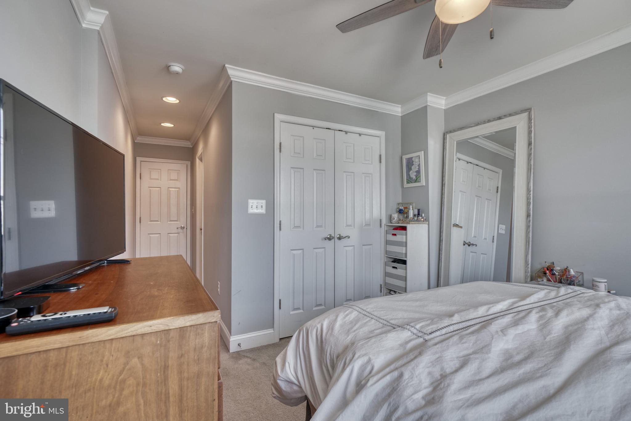 1818 Byrd Street Baltimore, MD 21230 - Photo 31 of 48 a bedroom with a bed and a mirror