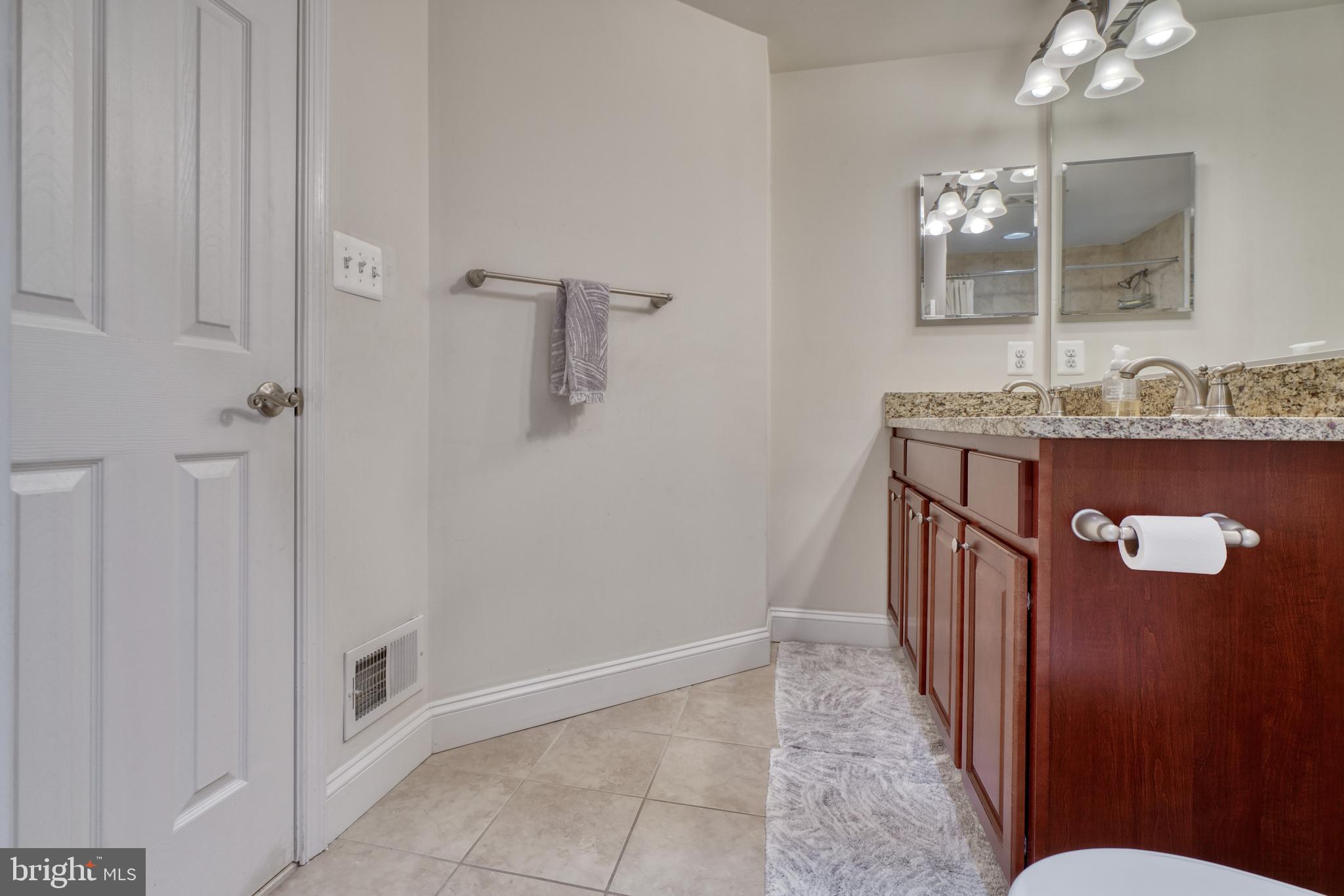 1818 Byrd Street Baltimore, MD 21230 - Photo 33 of 48 a bathroom with a sink and mirror