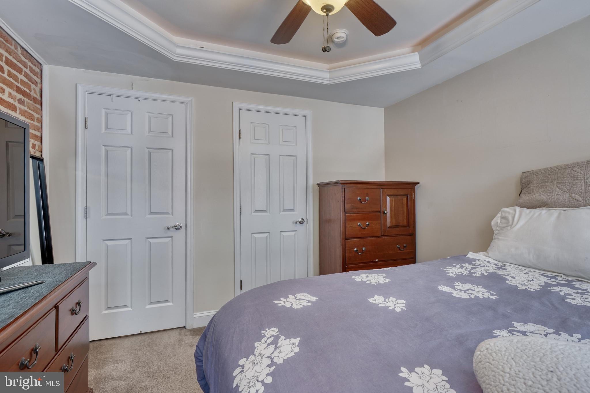 1818 Byrd Street Baltimore, MD 21230 - Photo 38 of 48 a bedroom with a bed and a dresser