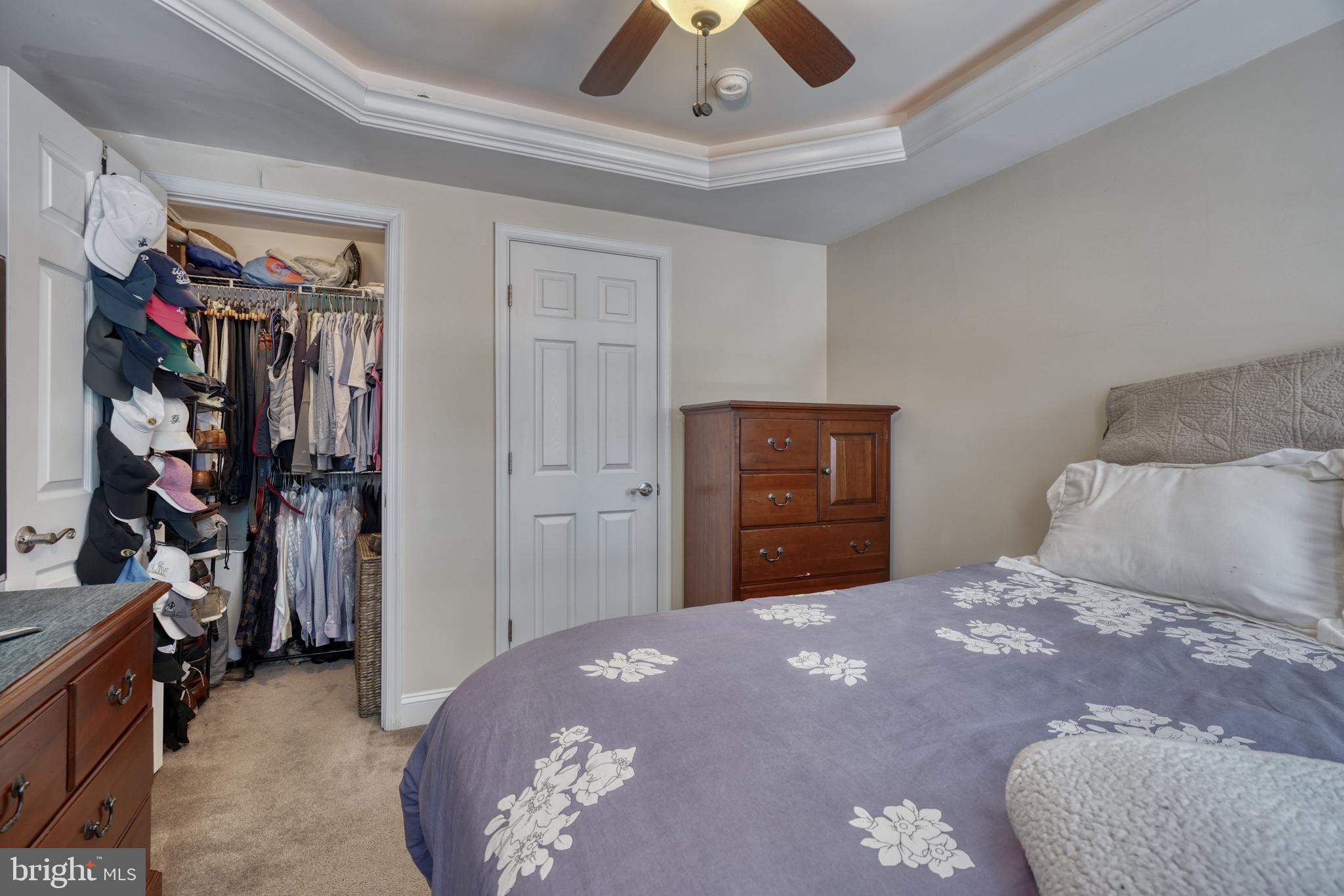 1818 Byrd Street Baltimore, MD 21230 - Photo 39 of 48 a bedroom with a large bed and a chandelier