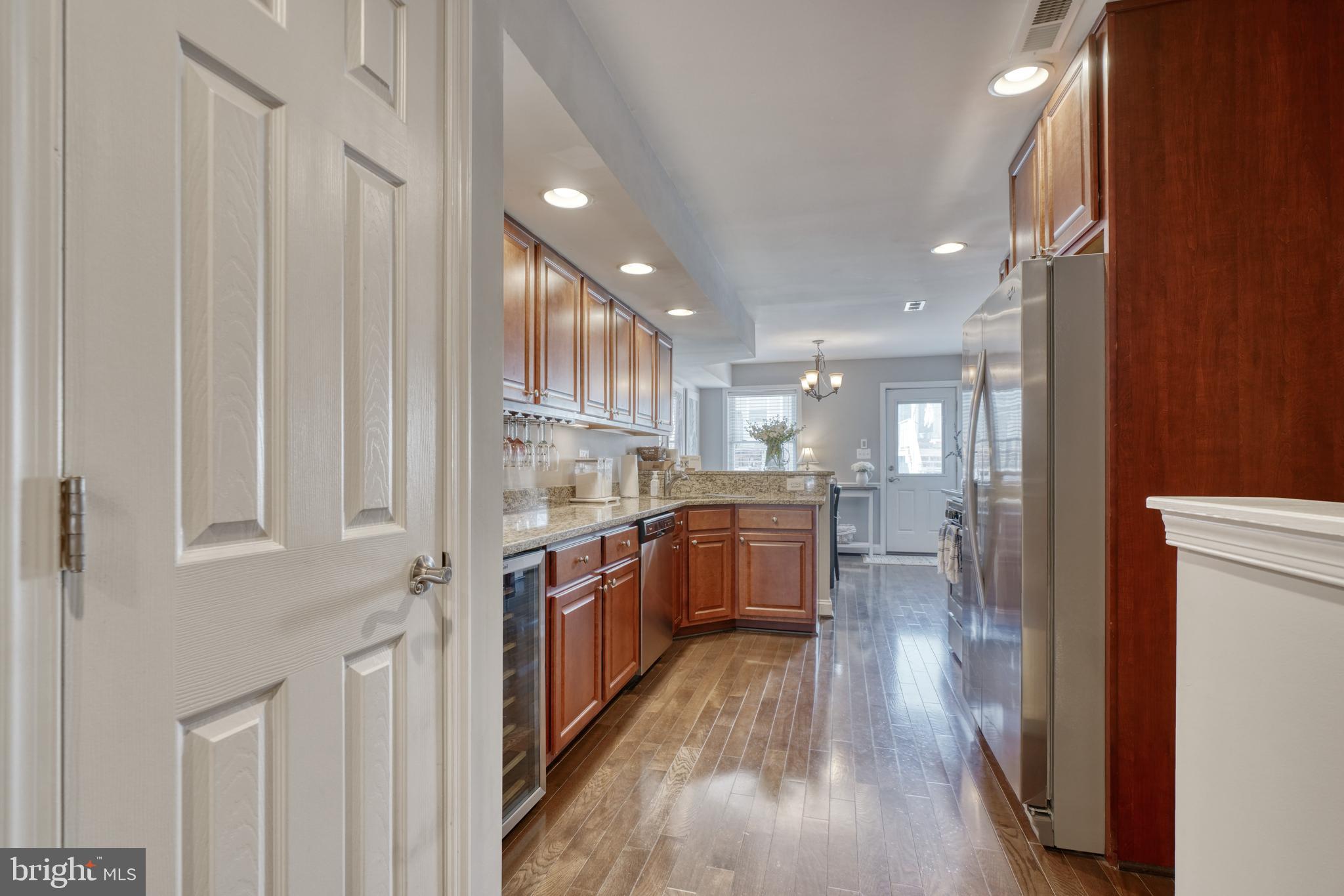 1818 Byrd Street Baltimore, MD 21230 - Photo 10 of 48 a open kitchen with white cabinets and stainless steel appliances