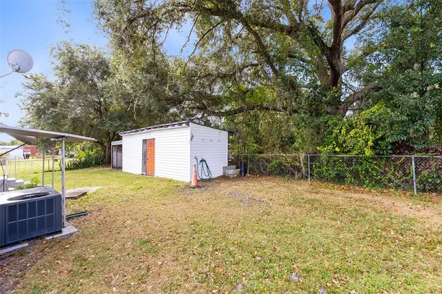 a backyard of a house with lots of green space