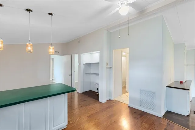 a kitchen with kitchen island a sink stainless steel appliances and cabinets