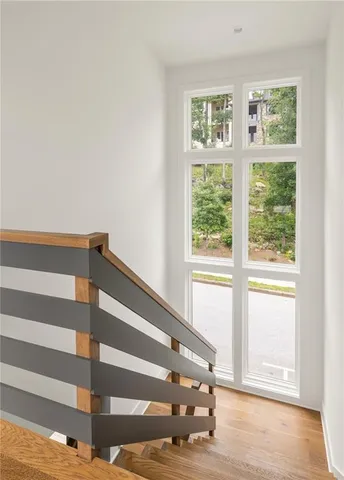 a view of wooden floor and windows in a room