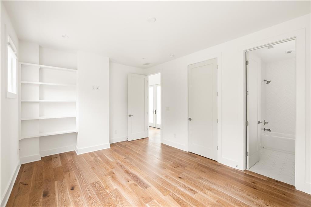 10904 Serenbe Lane Palmetto, GA 30268 - Photo 13 of 23 a view of empty room with wooden floor and entryway