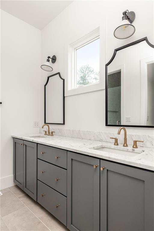 10904 Serenbe Lane Palmetto, GA 30268 - Photo 9 of 23 a bathroom with a double vanity sink and mirror