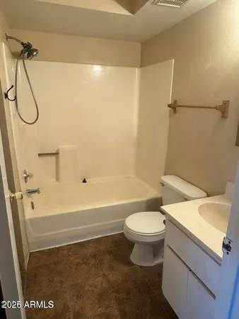 a bathroom with a sink a toilet and a shower