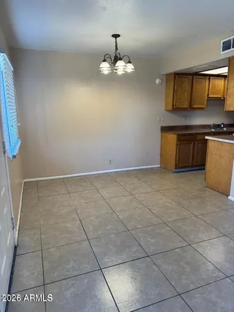 a view of kitchen with granite countertop cabinets
