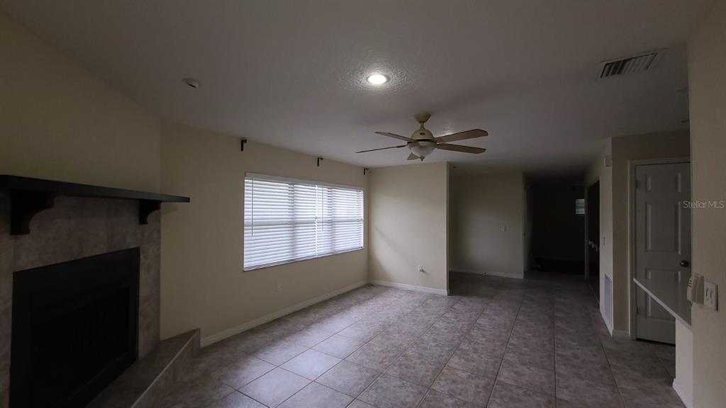 399 Barberry Lane Altamonte Springs, FL 32714 - Photo 8 of 19 a view of an empty room with a window