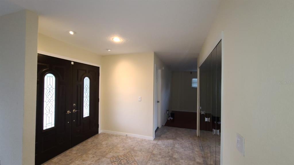 399 Barberry Lane Altamonte Springs, FL 32714 - Photo 9 of 19 an empty room with closet and mirrors