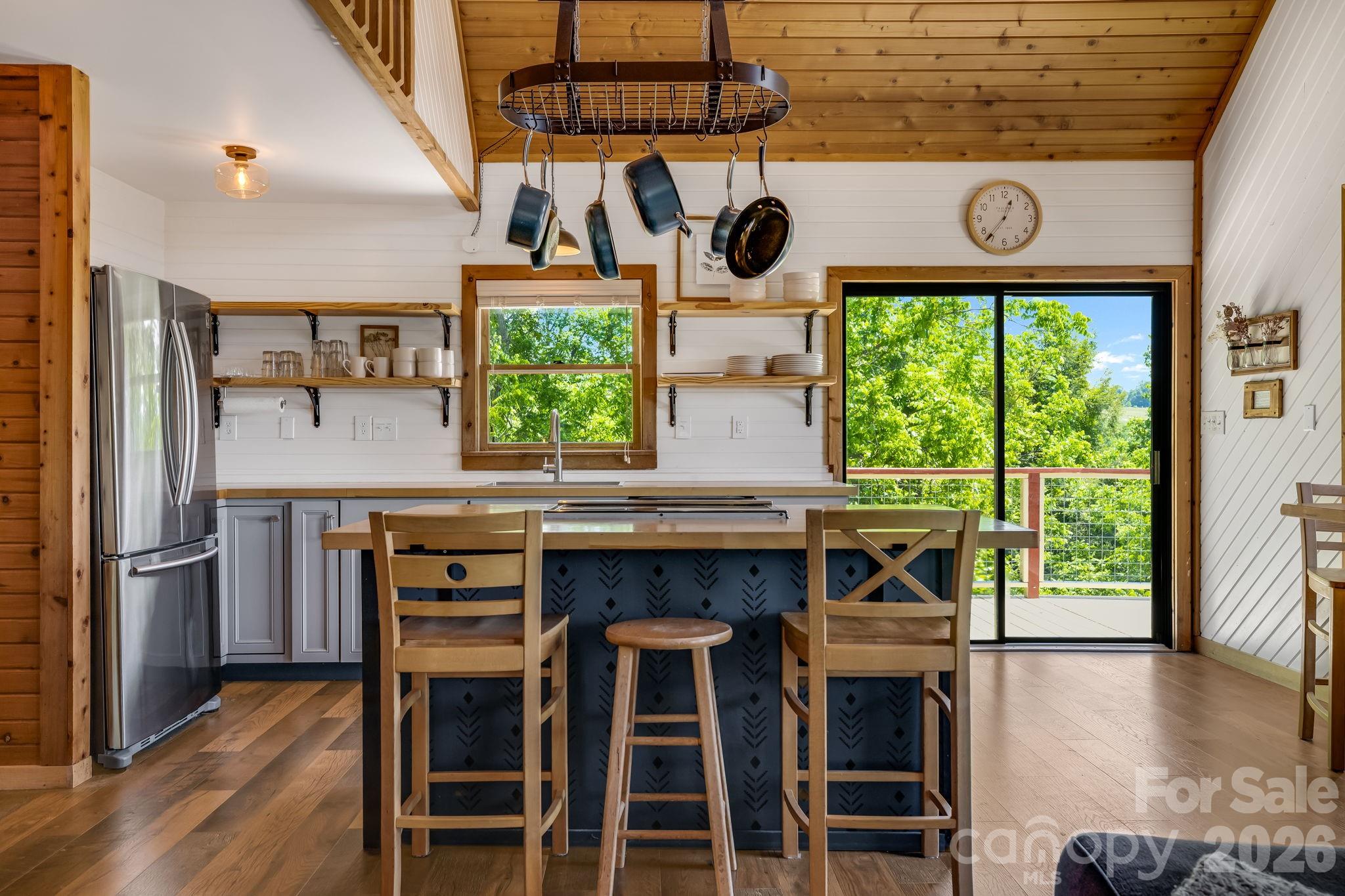 694 Boulder Road Marshall, NC 28753 - Photo 11 of 44 a kitchen with a table and chairs in it