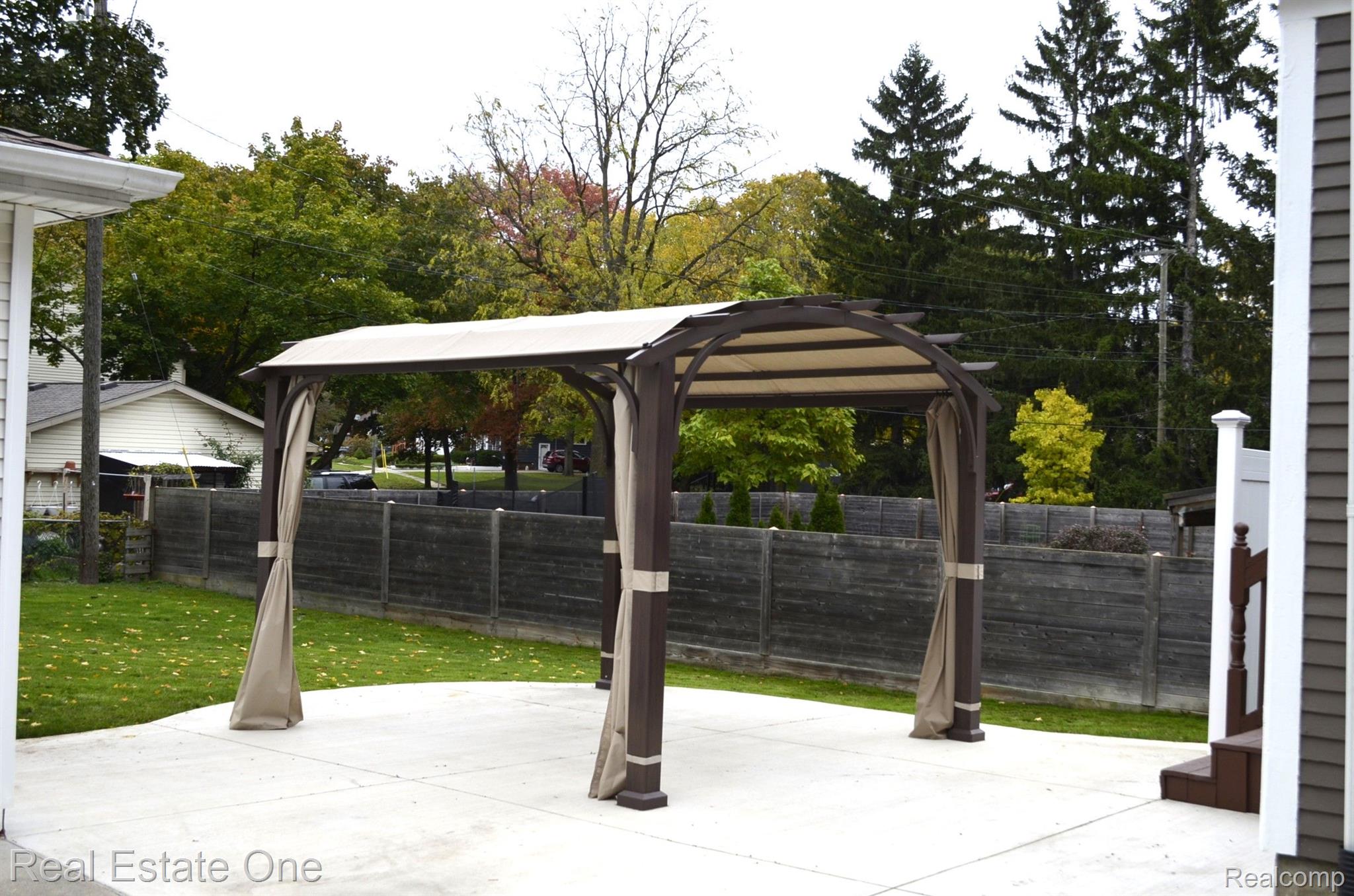 310 Maple Street Howell, MI 48843 - Photo 46 of 48 Concrete Patio with Cabana