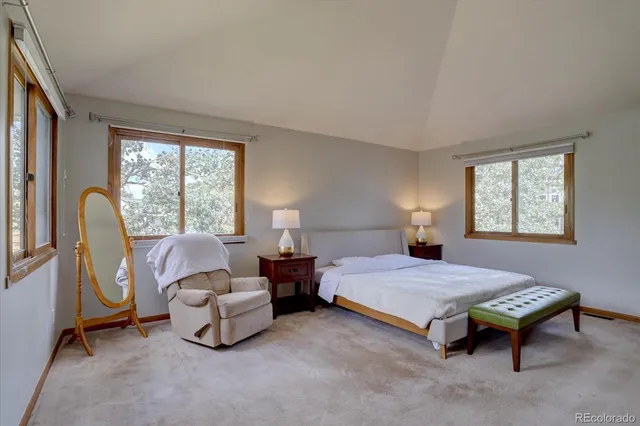 a bedroom with bed and a window