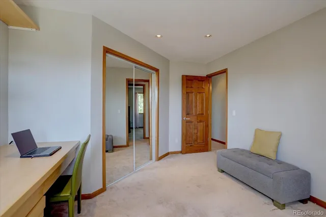 a bedroom with furniture and a window