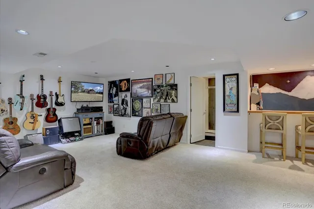 a view of a livingroom with workspace and a couch