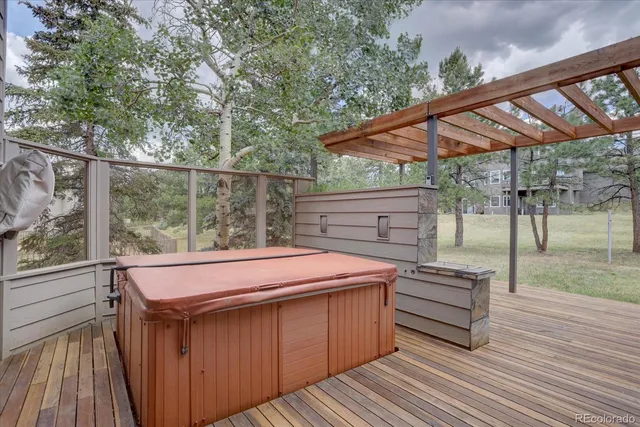 a balcony with furniture and wooden floor