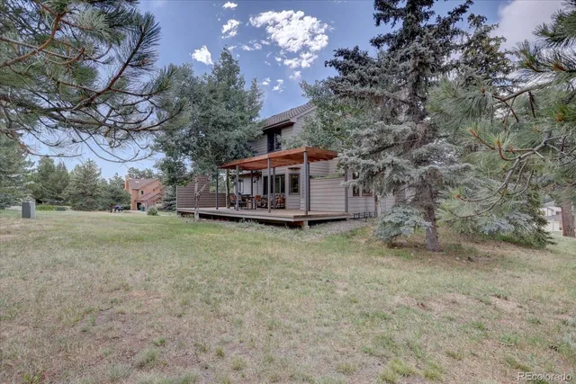 a house with trees in front of it