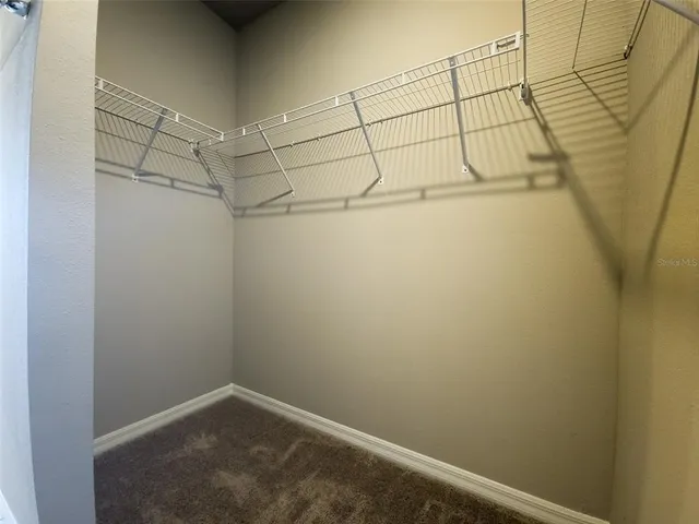 a view of a room with racks on the wall